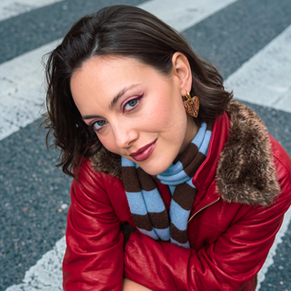Wildly In Love Bambi heart earring worn by model — editorial portrait