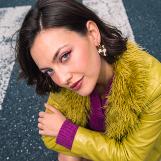 Wildly In Love Cow heart earring worn by model — editorial portrait