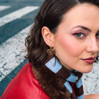 Wildly In Love Snake heart earring worn by model — editorial portrait